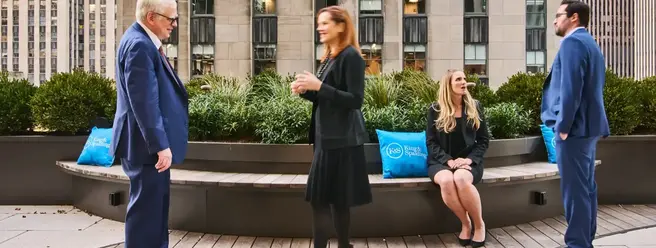 a group of people standing on a bench