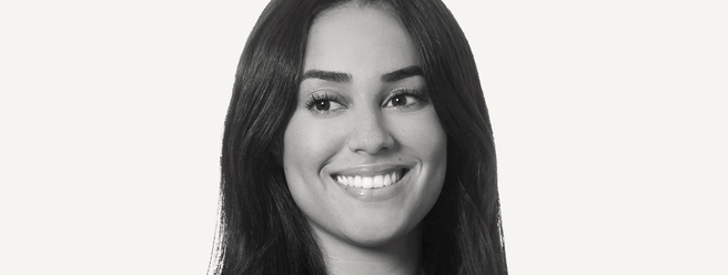 a woman with long hair smiling