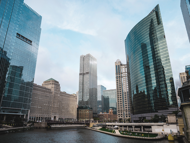 a city with tall buildings and a river