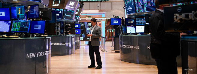a group of men standing in front of a screen
