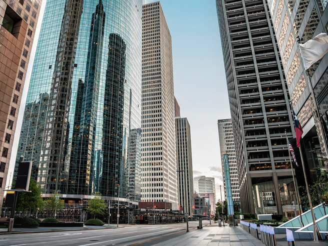 a city street with tall buildings
