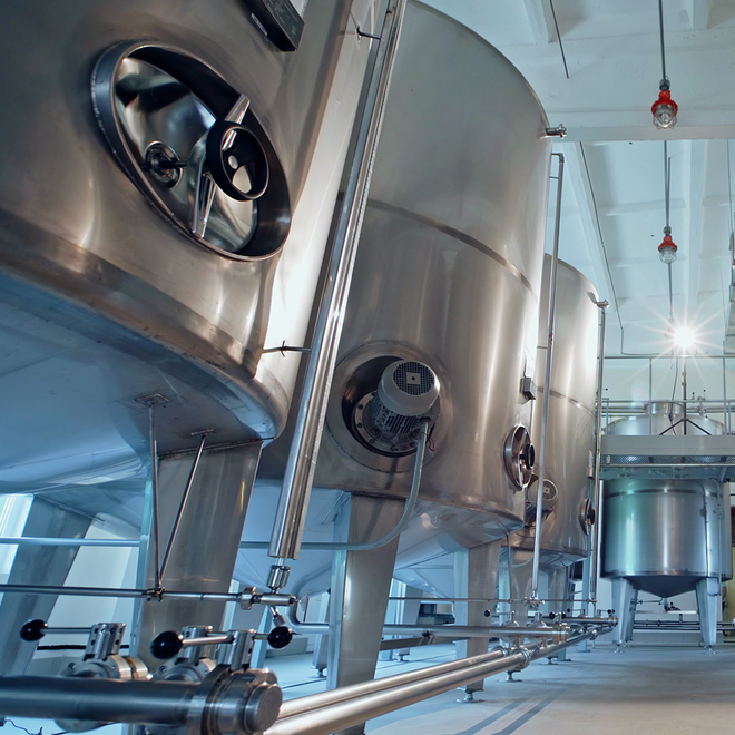 a large metal tanks in a factory