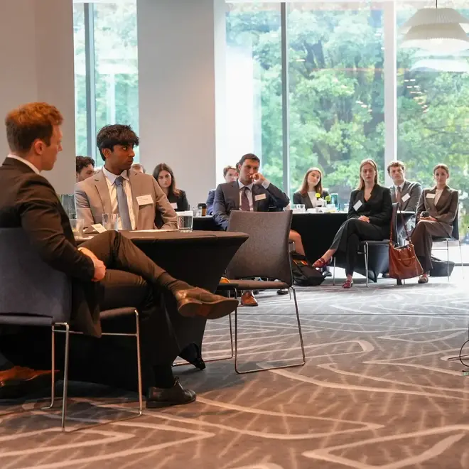 a group of people sitting in a room