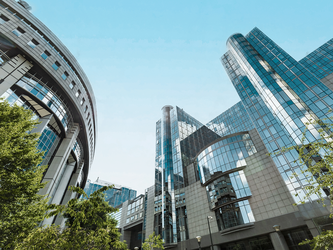 a group of buildings with glass windows