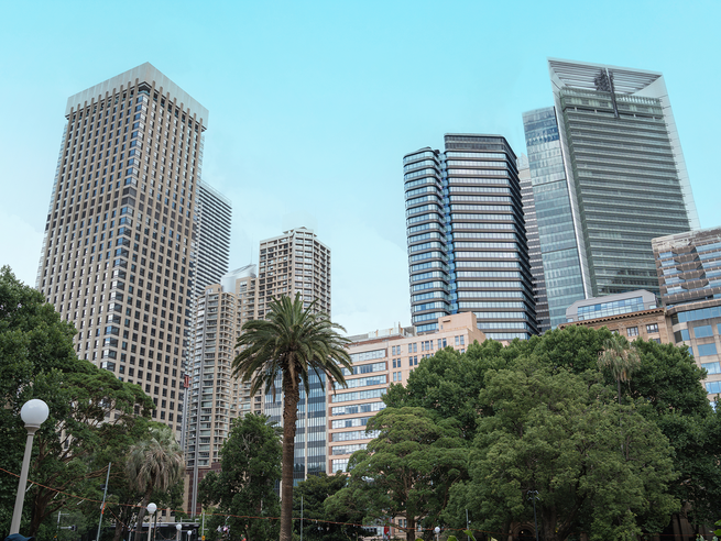 a group of tall buildings with trees