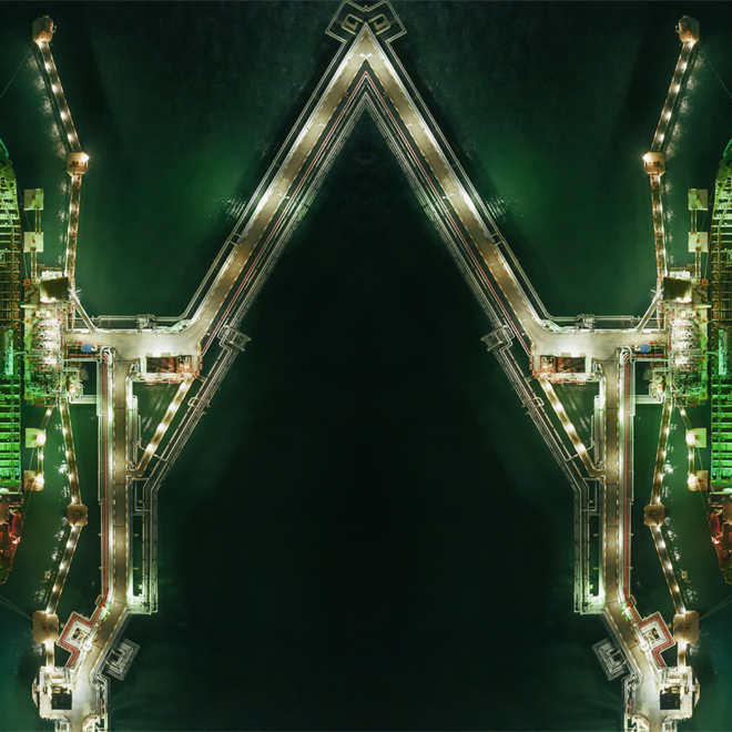 a group of ships in a port at night