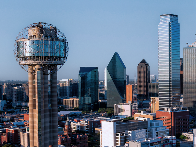 a city skyline with tall buildings