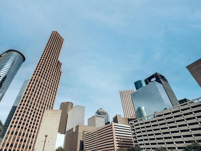 a city skyline with tall buildings
