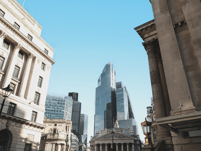 a street with tall buildings in the background